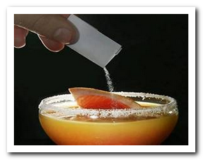 Picture of a drug being poured into a drink.